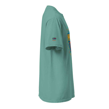 Side view of a unisex garment-dyed heavyweight t-shirt in teal color with short sleeves and relaxed fit
